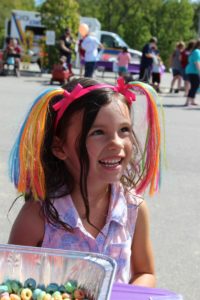 smiling young girl at 2nd annual community celebration
