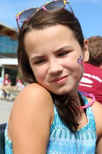 young girl with face paint at 2nd annual community celebration