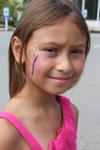 young girl with face paint at 2nd annual community celebration