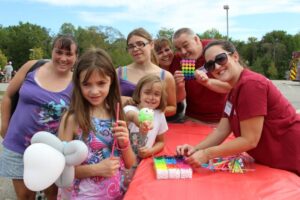 group of smiling people at 2nd annual community celebration