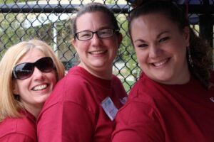 three women volunteers at 2nd annual community celebration