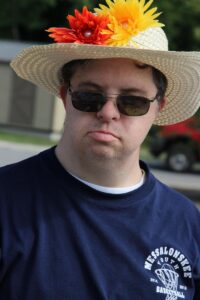 man in flower hat at 2nd annual community celebration