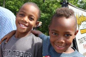 two smiling boys at 2nd annual community celebration