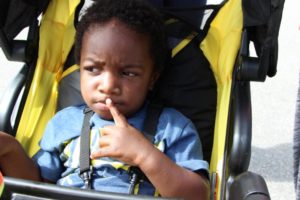 young boy in stroller at 2nd annual community celebration