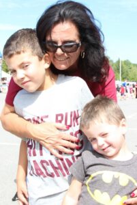 woman with two young boys at 2nd annual community celebration