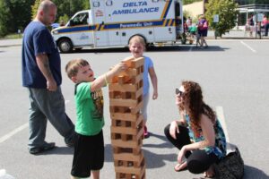 kids playing outdoor jenga at 2nd annual community celebration