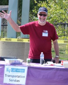 kvcap transportation services booth man at 2nd annual community celebration
