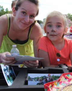 woman and young girl with cat face paint at 2nd annual community celebration