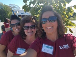 three women volunteers taking a selfie at 2nd annual community celebration