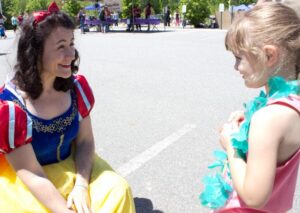 snow white talking to young girl at 3rd annual community celebration