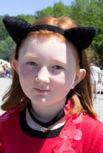 girl in cat ears at 3rd annual community celebration