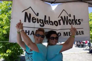 two neighborworks members with hand guns at 3rd annual community celebration