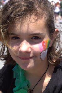 girl with face paint at 3rd annual community celebration