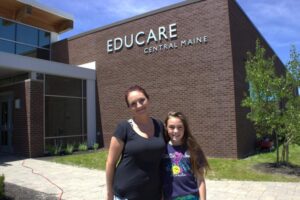 woman and girl in front of educare building at 3rd annual community celebration