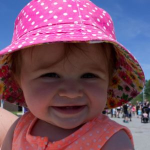 baby in hat at 3rd annual community celebration