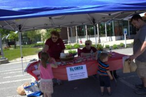 volunteers in kvcap booth at 3rd annual community celebration