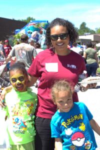 two girls and woman at 3rd annual community celebration