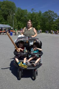 kids in stroller at 3rd annual community celebration