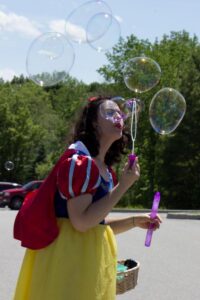 snow white blowing bubbles at 3rd annual community celebration