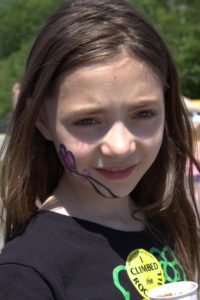 girl with face paint at 3rd annual community celebration