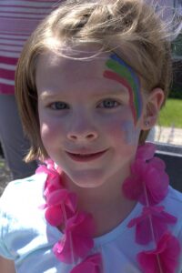 young girl with facepaint at 3rd annual community celebration