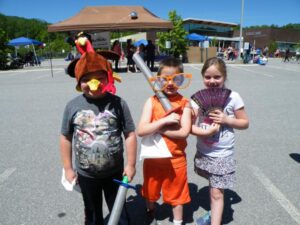 children with foam swords and fan enjoying 3rd annual community celebration