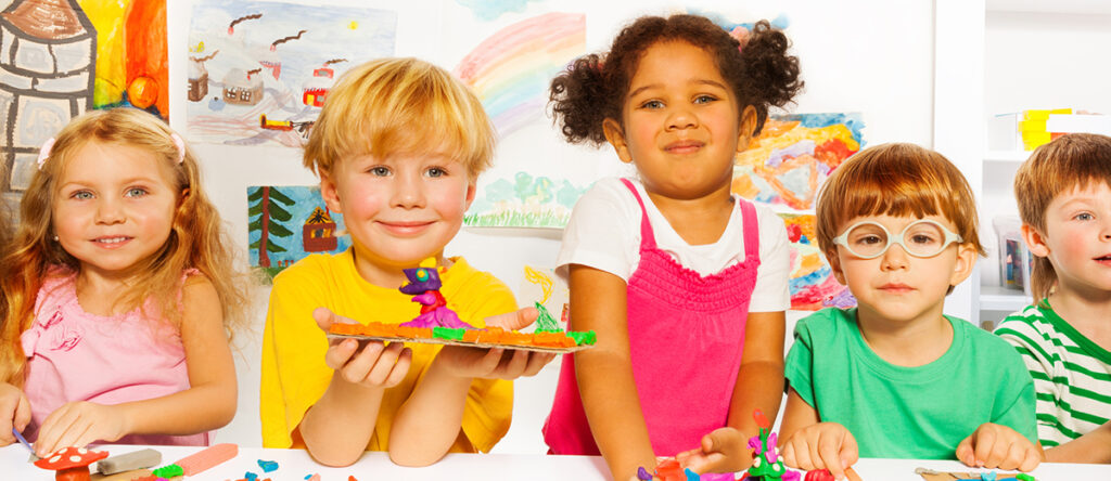 Happy Children At A Table